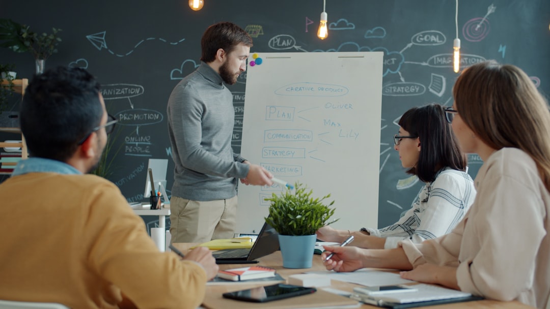 Team collaborating around a whiteboard in a modern office