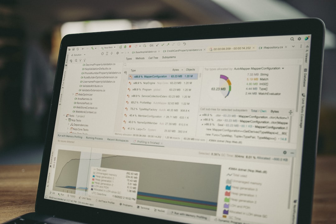 Laptop screen displaying code and data charts